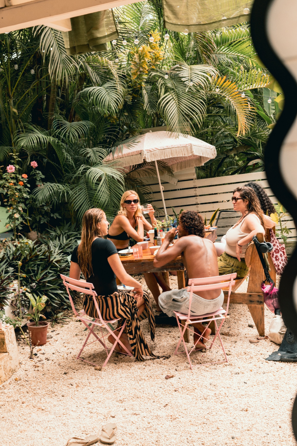 Isaac reading the line-up with the crew before paddling out